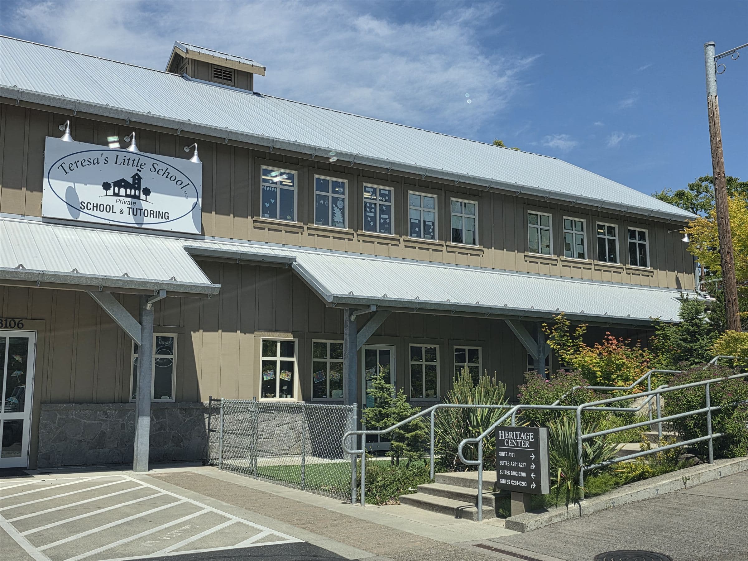Teresa's Little School — the tan building with its painted sign, on a sunny day in La Center