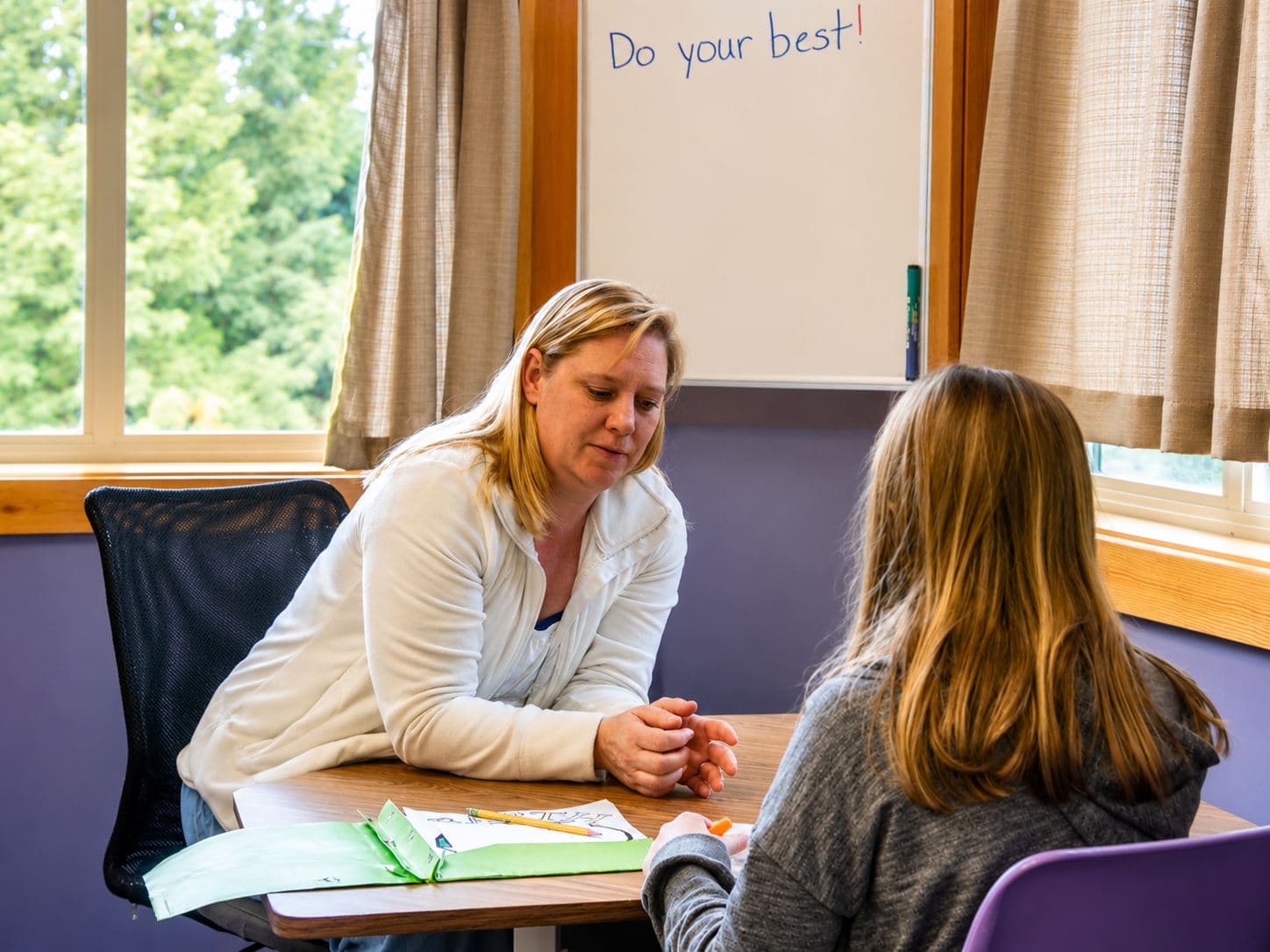 A tutor working one-on-one with a student